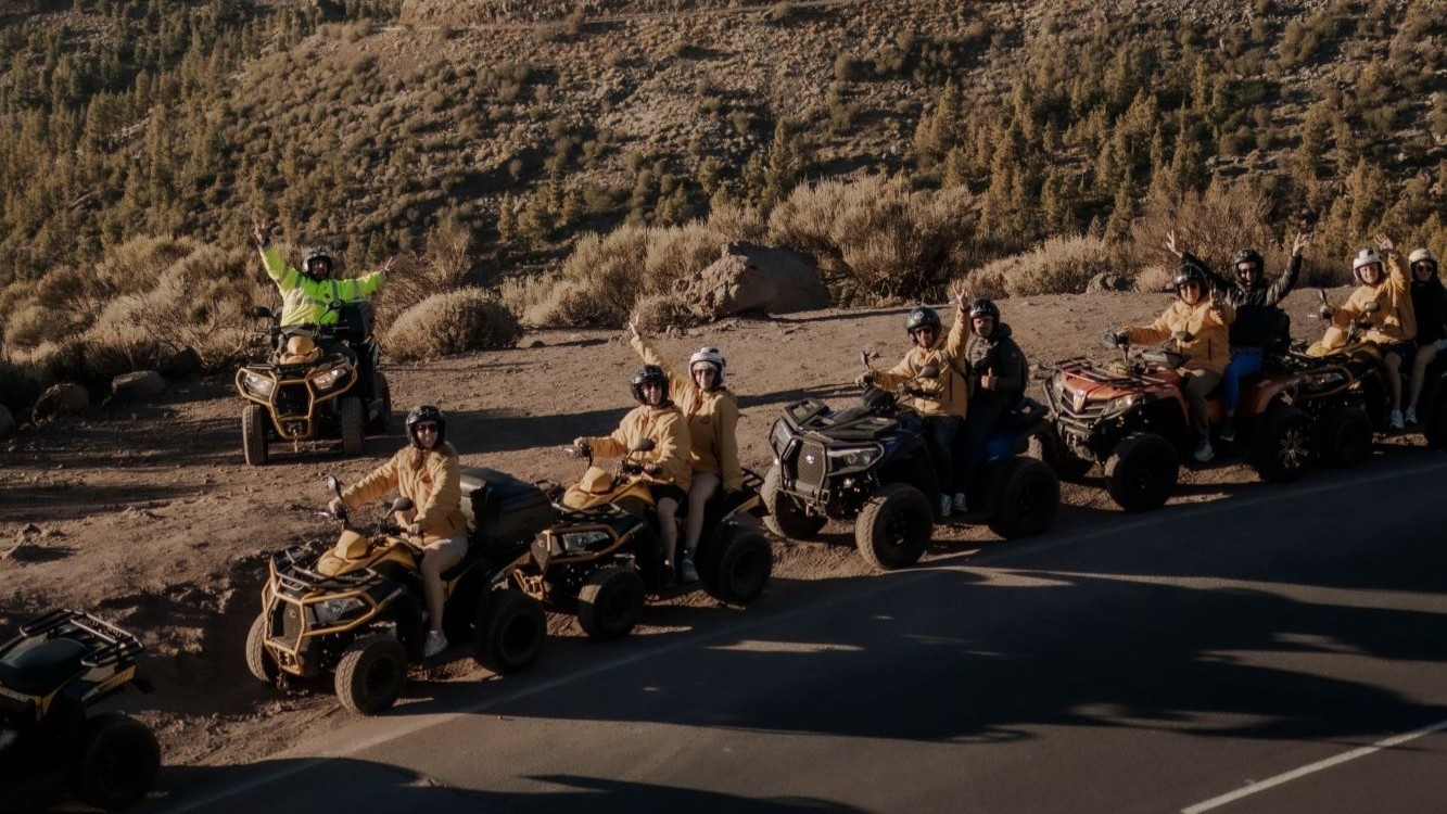 quad bikes on road with sign to mount Teide Tenerife